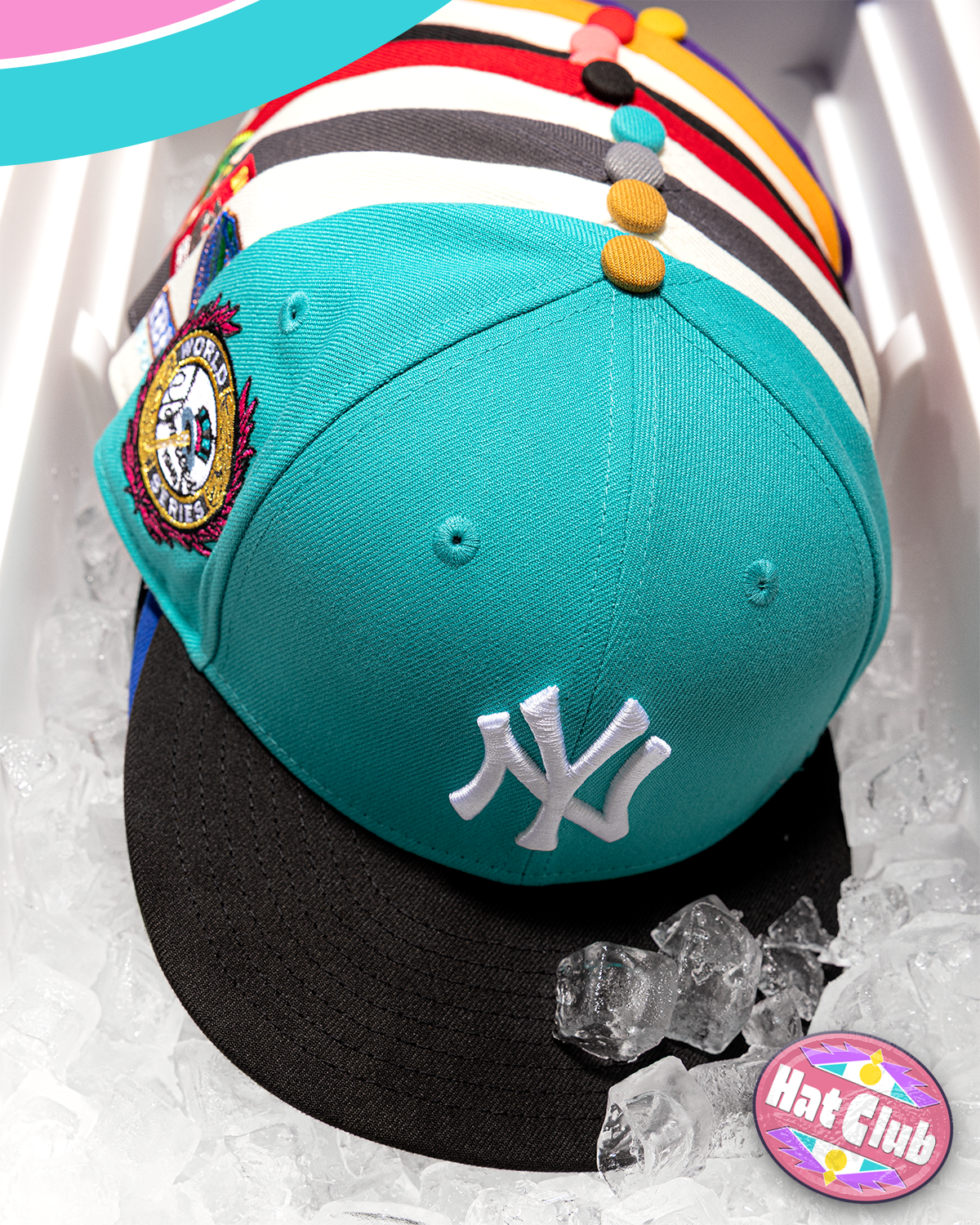 Teal New York Yankees fitted cap with colorful side patches displayed on ice, highlighting premium Hat Club MLB design details.